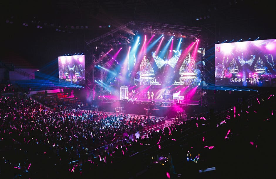 Colorful live concert with vibrant lighting, energetic crowd, and dynamic stage performance.